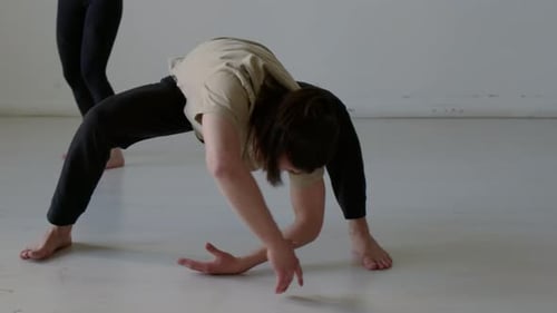 Couple Stretching and Practicing Balance in Studio