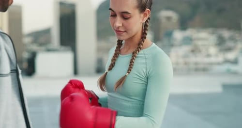Woman, boxing and coach training, sport and fitness outside with punch, glove and outdoor in a city