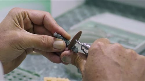 Dental Technician Precision Work in Laboratory Setting