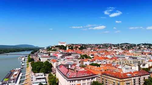Footage over the orange tops of the old-fashioned building in the historical part of the city.