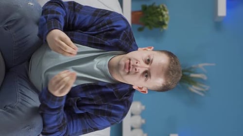 Vertical video of The man having a nervous breakdown is angry and does not feel well.