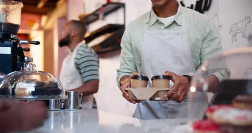 Takeaway, coffee and hands of barista giving customer a order in cafe, service and small business