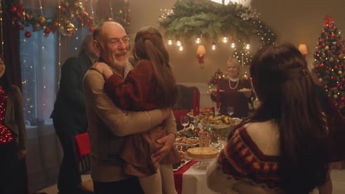 Family Christmas Celebration with Hugs and Dancing