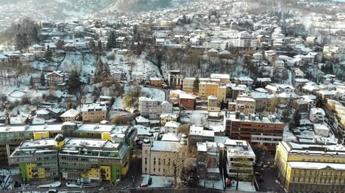 Morning drone shot during winter in Bosnia's capital Sarajevo. A day after the snow has fallen. Sara