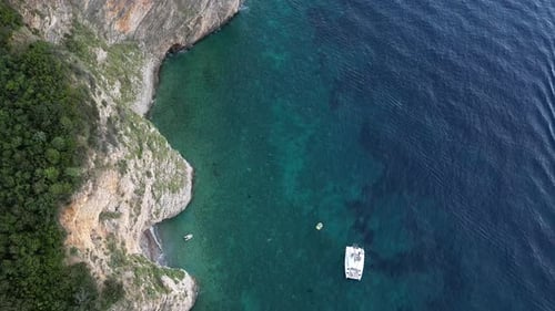Beautiful, wild beach on a rocky island. Idyllic landscape. Aerial view.