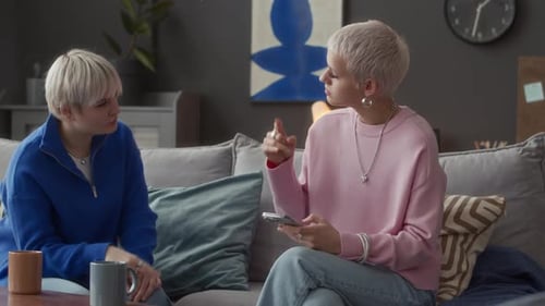 Young Adults Talking on Couch