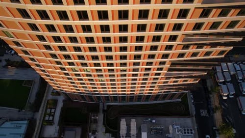 Aerial view rising in front windows of a tall building, sunset in New York, USA