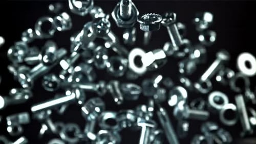 A Variety of Fasteners Fly Up and Down Filmed on a Highspeed Camera at 1000 Fps