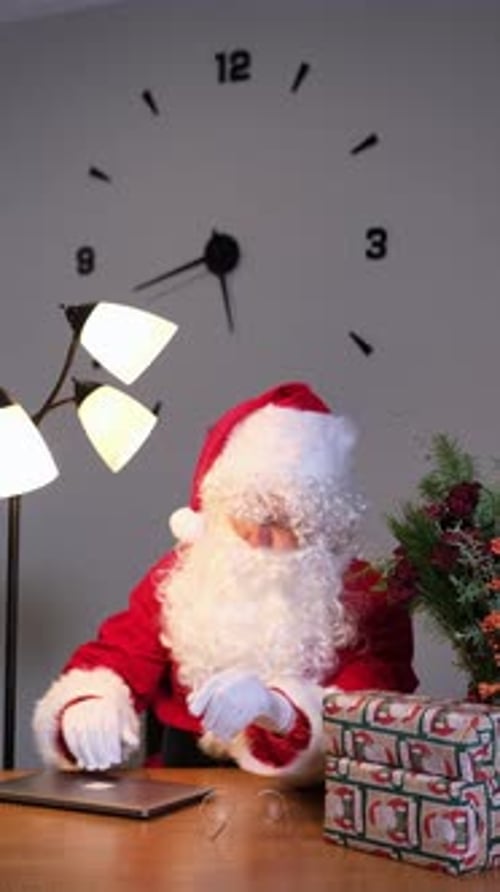 Tired Santa Claus Sleeping at His Desk