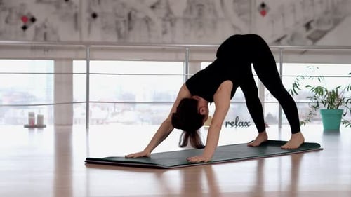 Asian Fit Woman Doing Yoga Training Practicing Flexibility at Studio Female Performing Adho Mukha