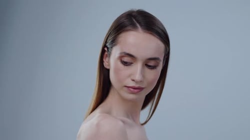 Young Woman Posing with Bare Shoulders