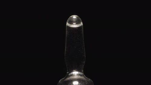 Empty Glass Ampoule with Long Tip Reflecting Studio Light