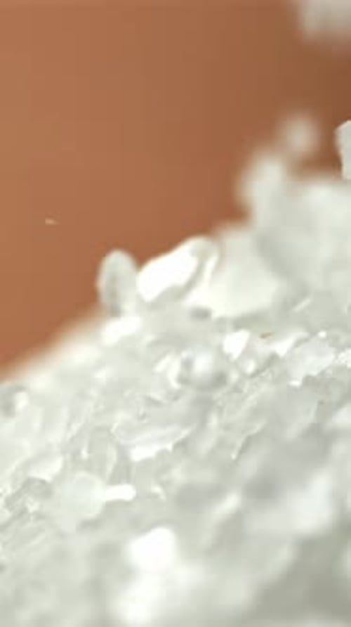 Salt Crystals Fall Into a Pile Filmed on a Highspeed Camera at 1000 Fps