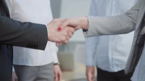 Close Up of Business People Shaking Hands in Office Successful Corporate Partnership Deal Welcoming