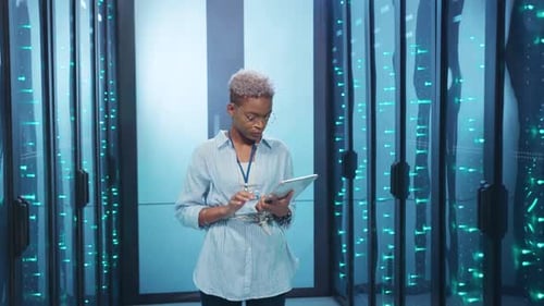 Tech Professional Working in a Futuristic Environment with a Tablet in Hand Innovating Solutions