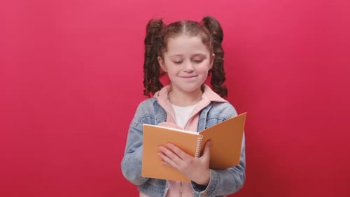 Girl Thinking and Writing in Notebook