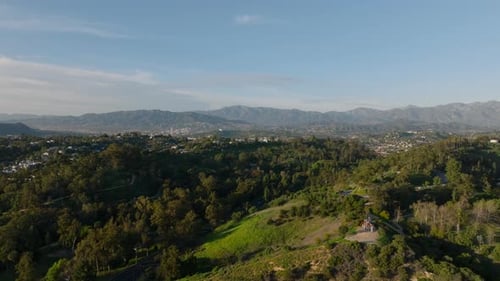 Aerial View of Nature on Suburbs Trees in Park and Mountains in Background Los Angeles California