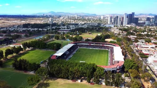 Rotating View of Soccer Stadium with Downtown Skyline Behind