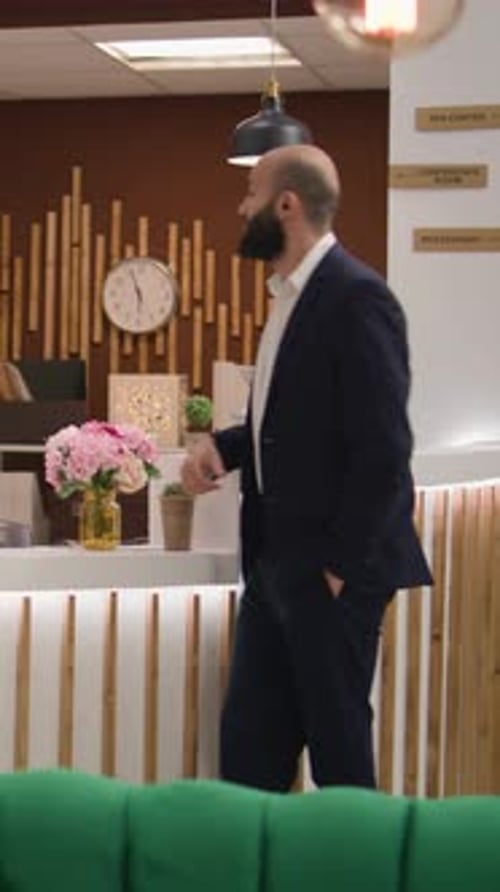 Hotel Clerk Helping a Guest Check In