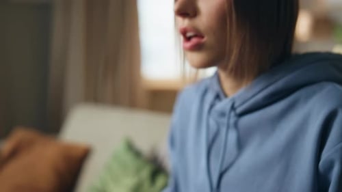 Woman Hands Pressing Console Playing Online Video Game at Home Couch Closeup