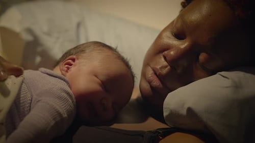 Sleeping Baby and Mother Resting Together