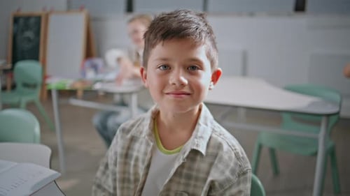 Elementary Student Smiling in Classroom Portrait
