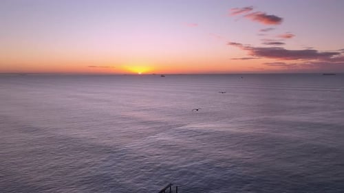 Aerial view of coastline seen during golden hour