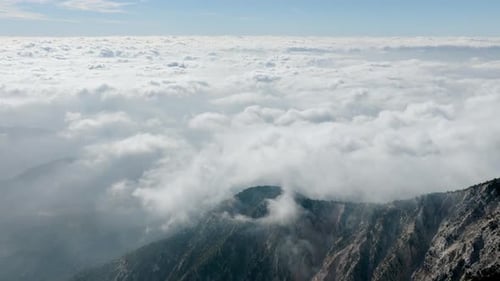 Clouds Over Rugged Mountain Peaks Landscape