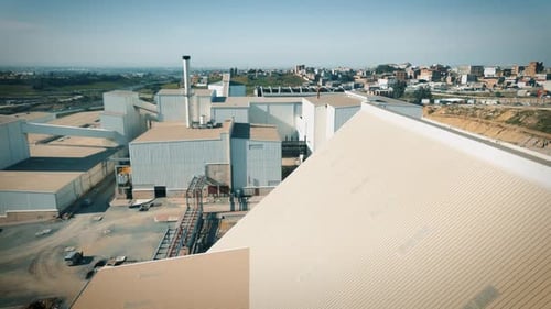 aerial shot of a production factory hangar made of metal frame