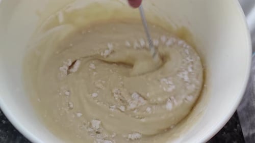 Baking Batter Being Mixed in Kitchen Bowl