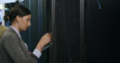 Woman Using Tablet in Data Center Server Room