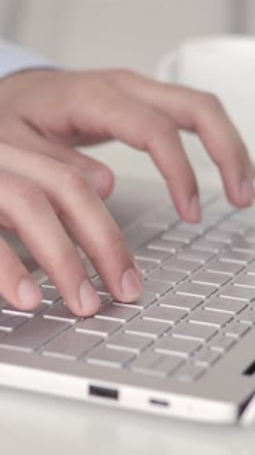 Close Up of Hands Typing On Laptop, Vertical Video