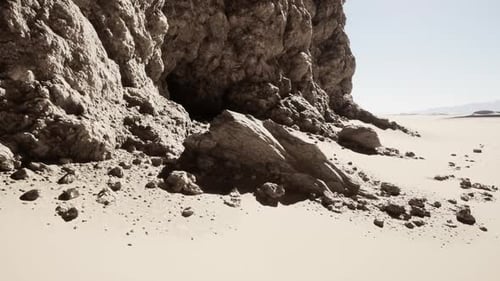 Massive Rock Formation Amid Desert Landscape