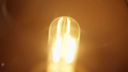 Extreme Close Up Of Glowing Lightbulb