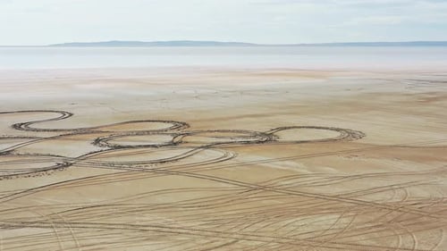 Aerial view of tire tracks on the ground by lake Tuz, Turkey.