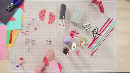 Child and Adult Making Ladybug Crafts Together