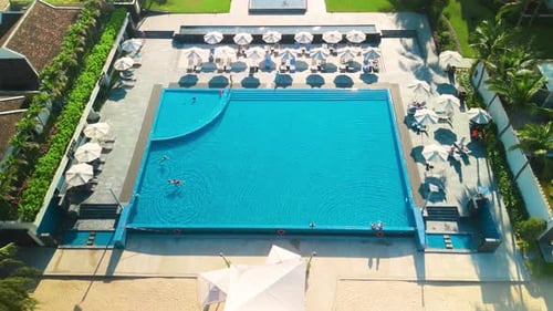 Aerial View Showing Luxury Resort Swimming Pool Crystal Clear Waters Surrounded By Tourists Lounging