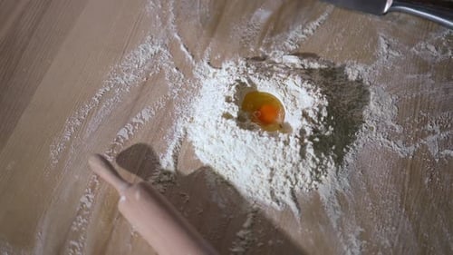 Egg and Flour for Dough Preparation on Counter