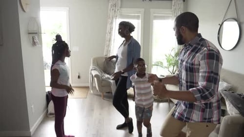Family Having Fun Dancing Together in Living Room