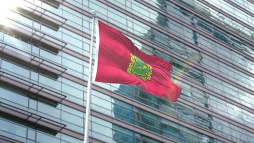 Realistic 3D Flag Waving in Front of Modern Corporate Building