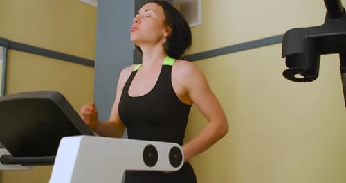 Fit Caucasian Woman Working Out on a Treadmill Cardio Exercise on a Treadmill