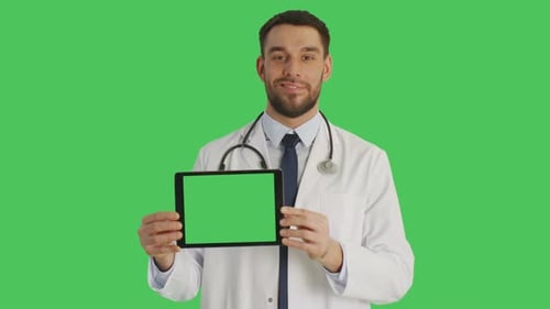 Mid Shot of a Smiling Doctor Holding Horizontally Tablet Computer with Green Screen. Green Screen i