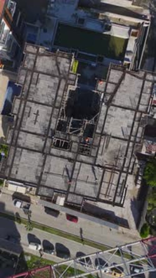 Vertical Video Workers Preparing New Floors With Scaffolding and Tools Captured Vertically on a