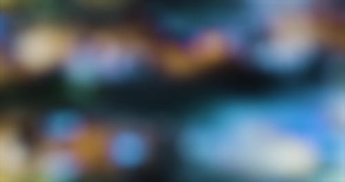 Abstract Background of Blurred Gold, Blue, and Green Lights