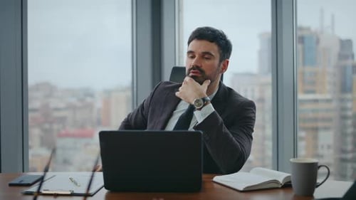 Thoughtful Businessman Speaking Online Meeting Sitting Office Workplace Close Up