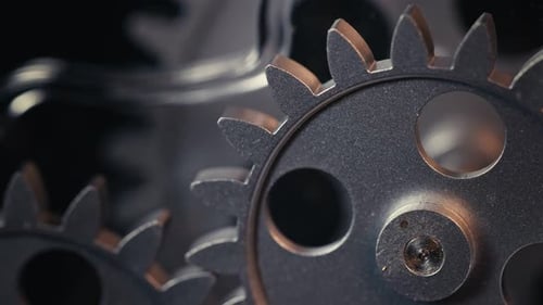 Silver Gears Rotating in Macro Shot