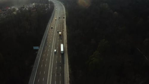 Road transport truck industry. highway top view follow vehicle aerial footage.