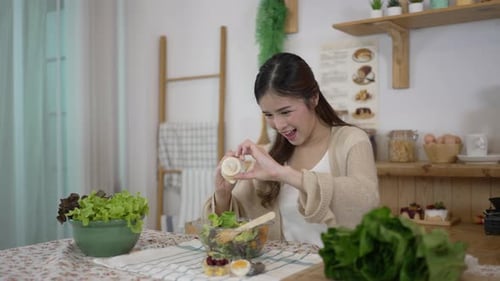 Woman Preparing Salad in Bright Home Kitchen