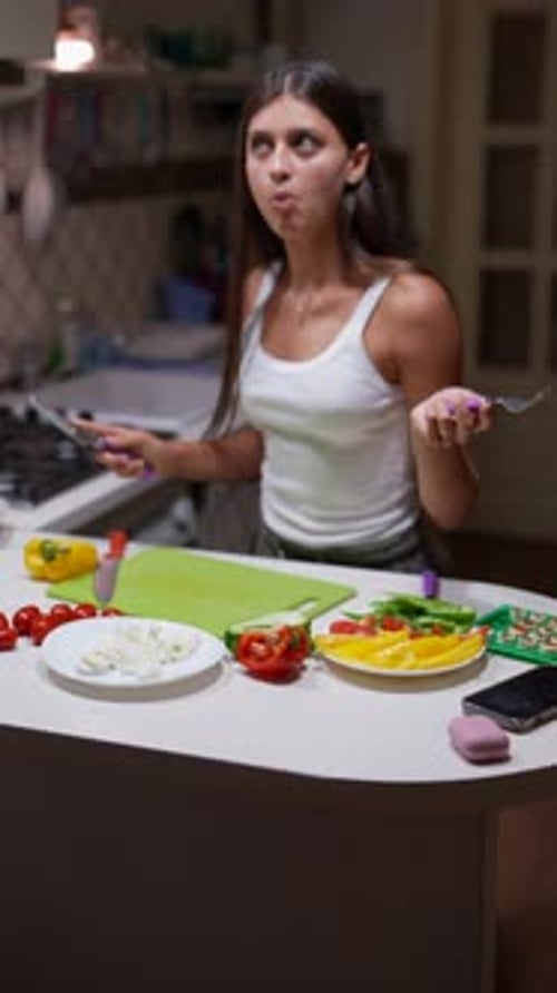 Young Woman Prepares Fresh Vegetables in Kitchen
