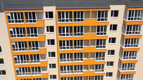 Facade of newly built skyscraper. Modern building with bright walls in the city.